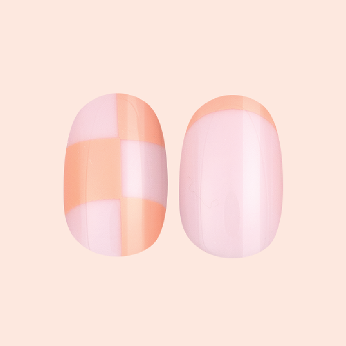 Sherbet Checker Party | Short | Round - Tab Press-On nails with peach and pastel pink checkerboard and color block design