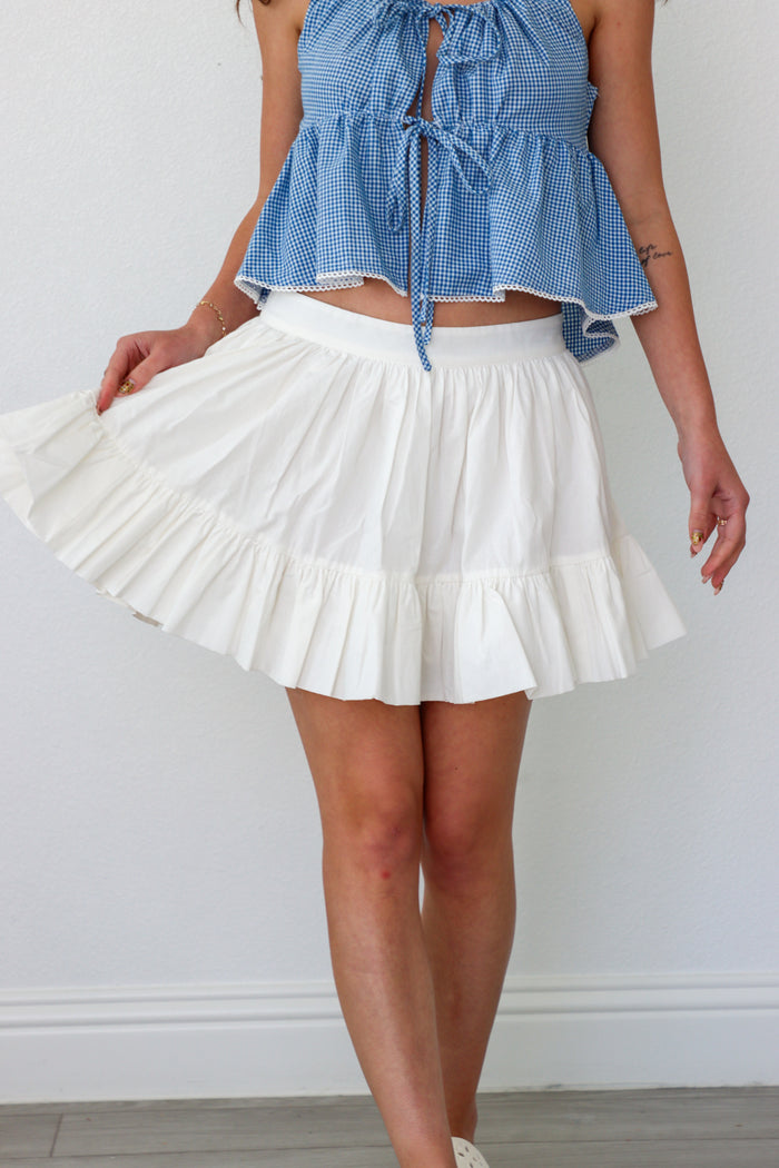 girl wearing short white skirt