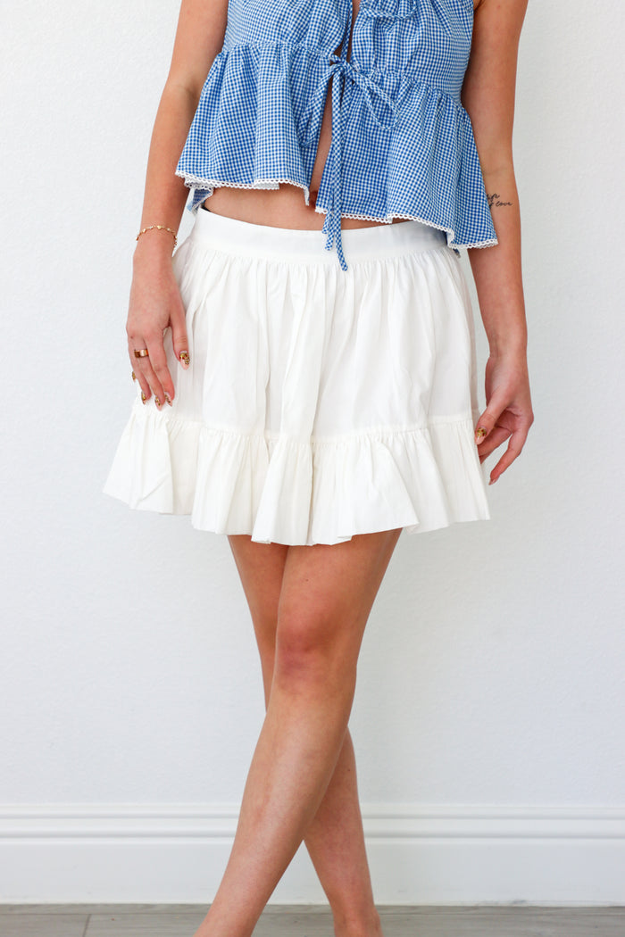 girl wearing short white skirt