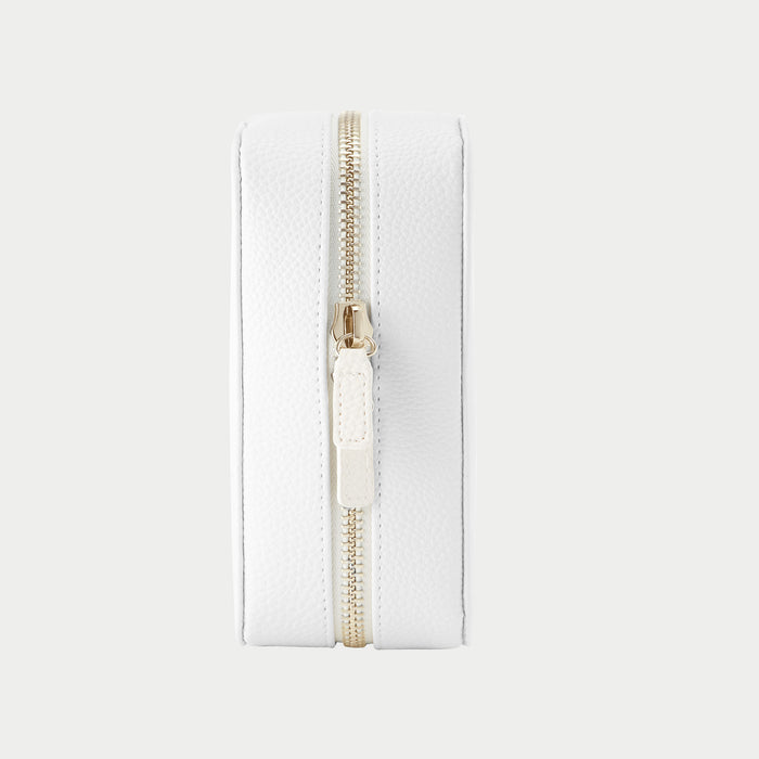 White pouch with a gold zipper on a light gray background