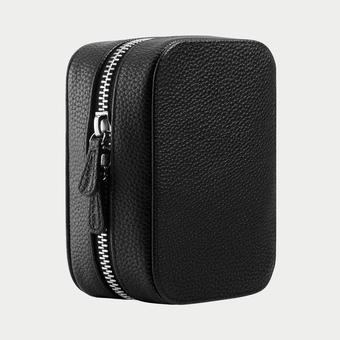 Black textured zippered pouch on a light gray background