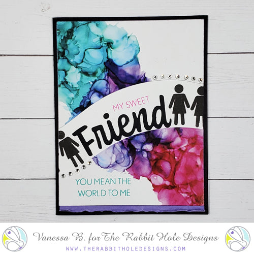 The Rabbit Hole Designs - Stamps - Friend. Deeply etched, clear photopolymer stamps for precise placement. The word Friend is sized so that it may be stamped onto the shadow layer from the coordinating dies (sold separately). Made in USA.  Coordinates with Friend - Scripty Word with Shadow Dies & Friend - Scripty Word Hot Foil Plate. Available at Embellish Away located in Bowmanville Ontario Canada. example by Vanessa B.
