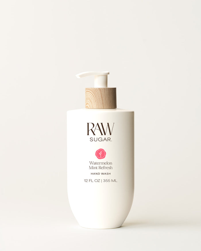 Bottle of Raw Sugar Watermelon Hand Wash on a cream background, designed to help gently cleanse hands with clean ingredients.