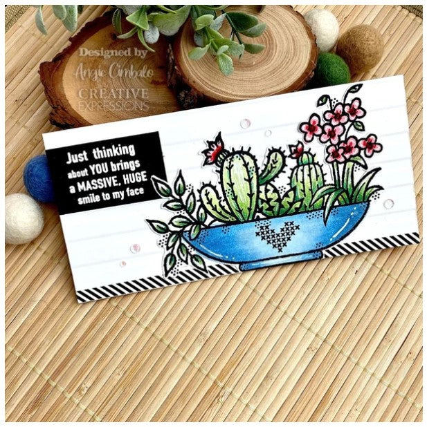 Woodware - 4"x6" Clear Singles Stamp - Plant Display. On trend stamp with a display of succulents with a love theme. Add a personal touch with your favourite colouring medium and the fun words. Designed by Francoise Read. These stamps would be perfect for cards and scrapbook pages as well as mixed media or fun décor projects. Available at Embellish Away located in Bowmanville Ontario Canada. card by designer Angie Cimbalo