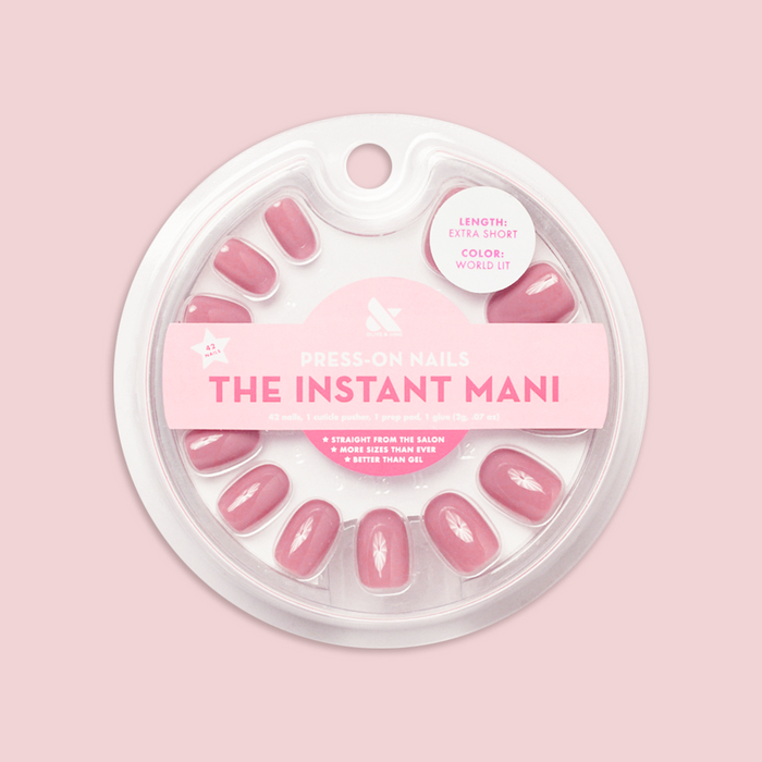 World Lit - Press-On | Extra Short | Round showing packaged mauve press-on false nails in round clear case on pink background